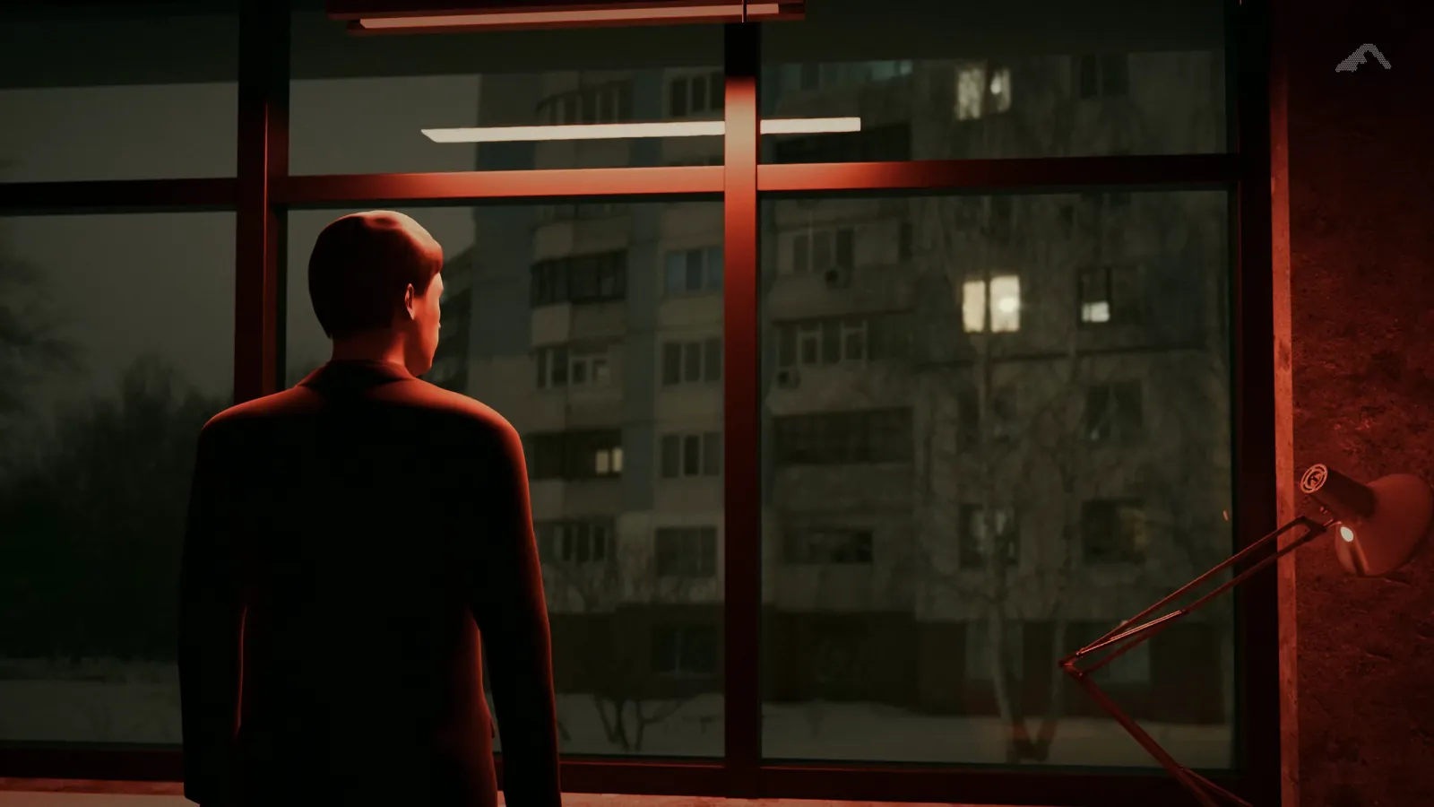 Opening frame of the film: a figure at a seventh-floor office window in Kyiv at night, the room lit red.